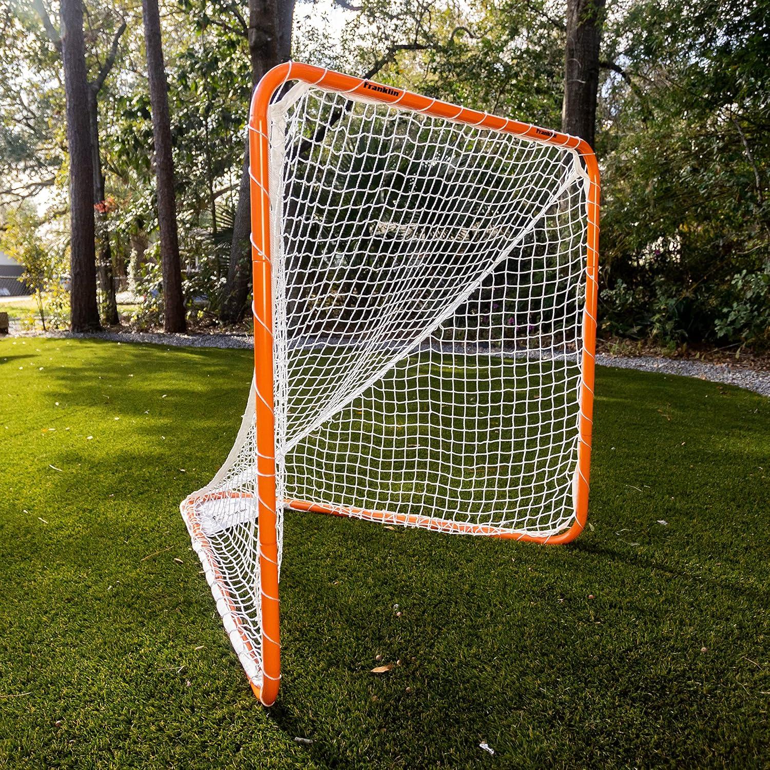 imageFranklin Sports Franklin Sports Backyard Lacrosse Goal Kids Adult Lacrosse Training Net Lacrosse Training Equipment Perfect for Youth Adult TrainingOrange